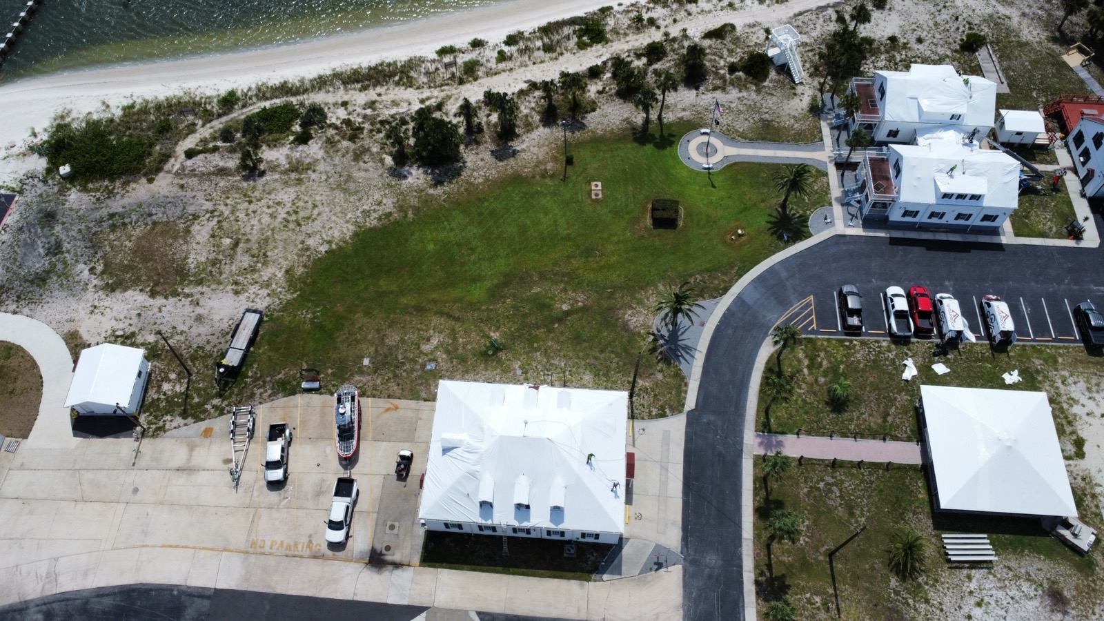 Coast Guard station buildings in Florida enclosed under white membrane